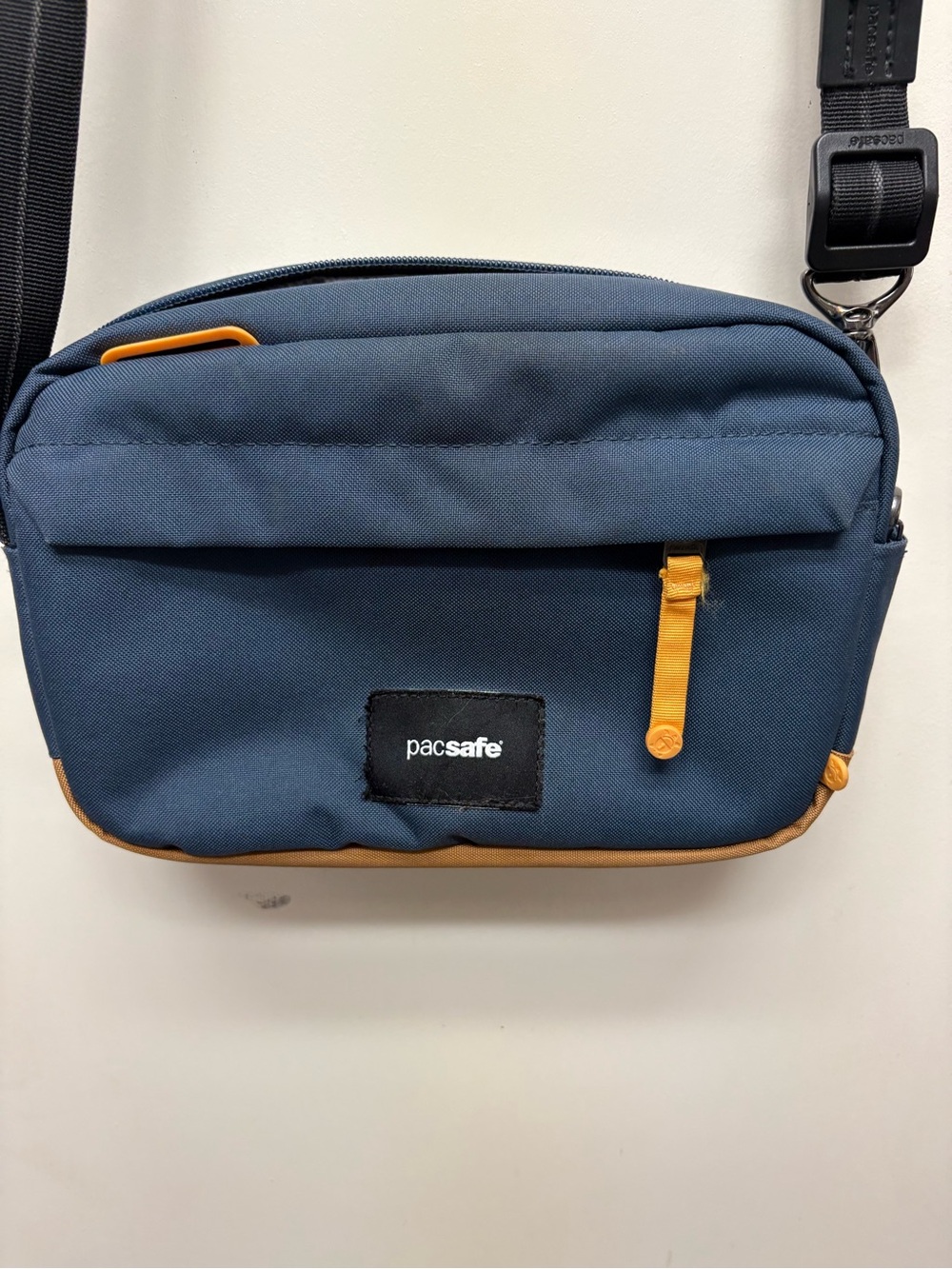 Pacsafe Navy and Tan Crossbody Sling Bag with Contrasting Accents